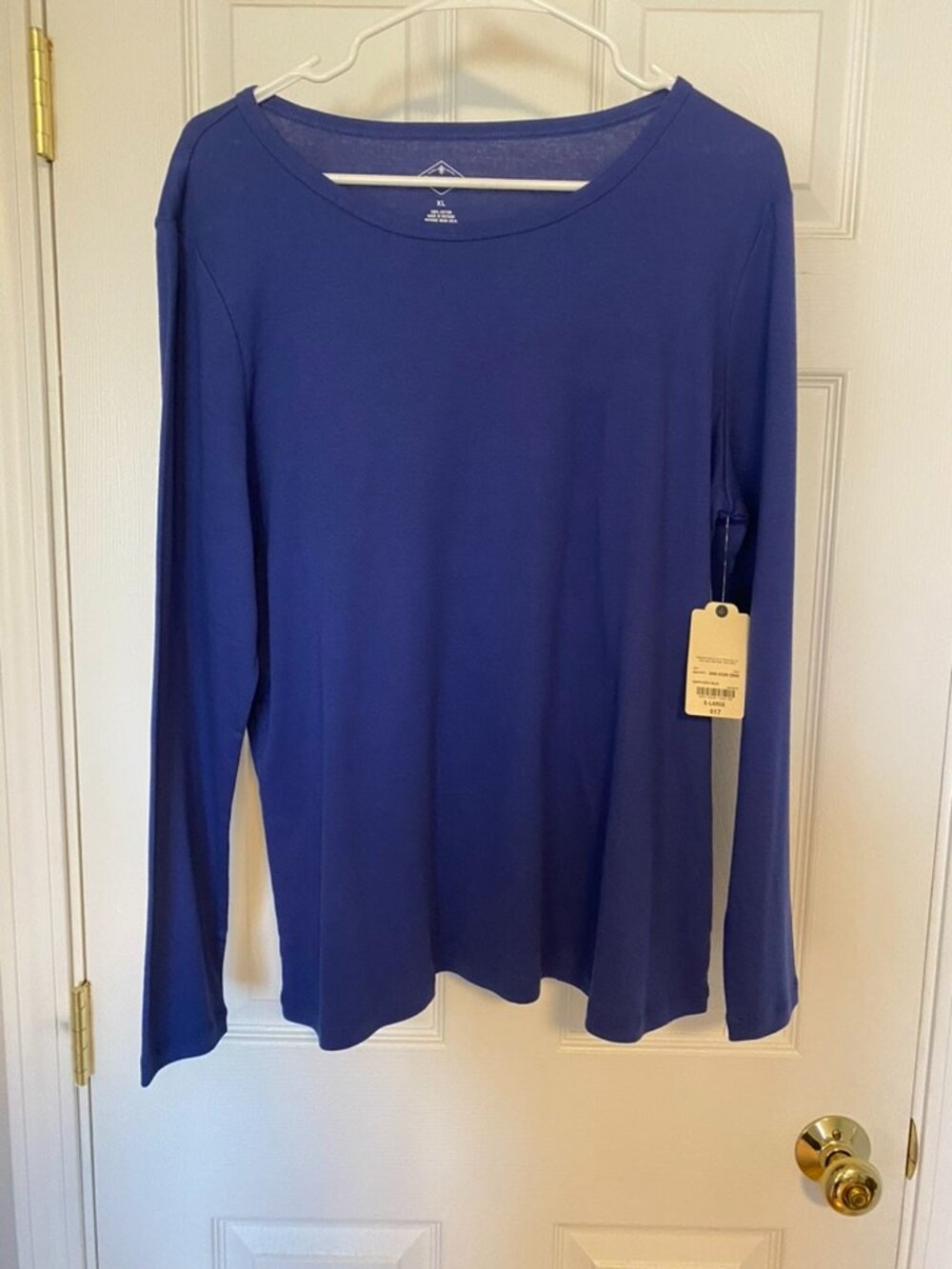 Blue long sleeved T-shirt with tags